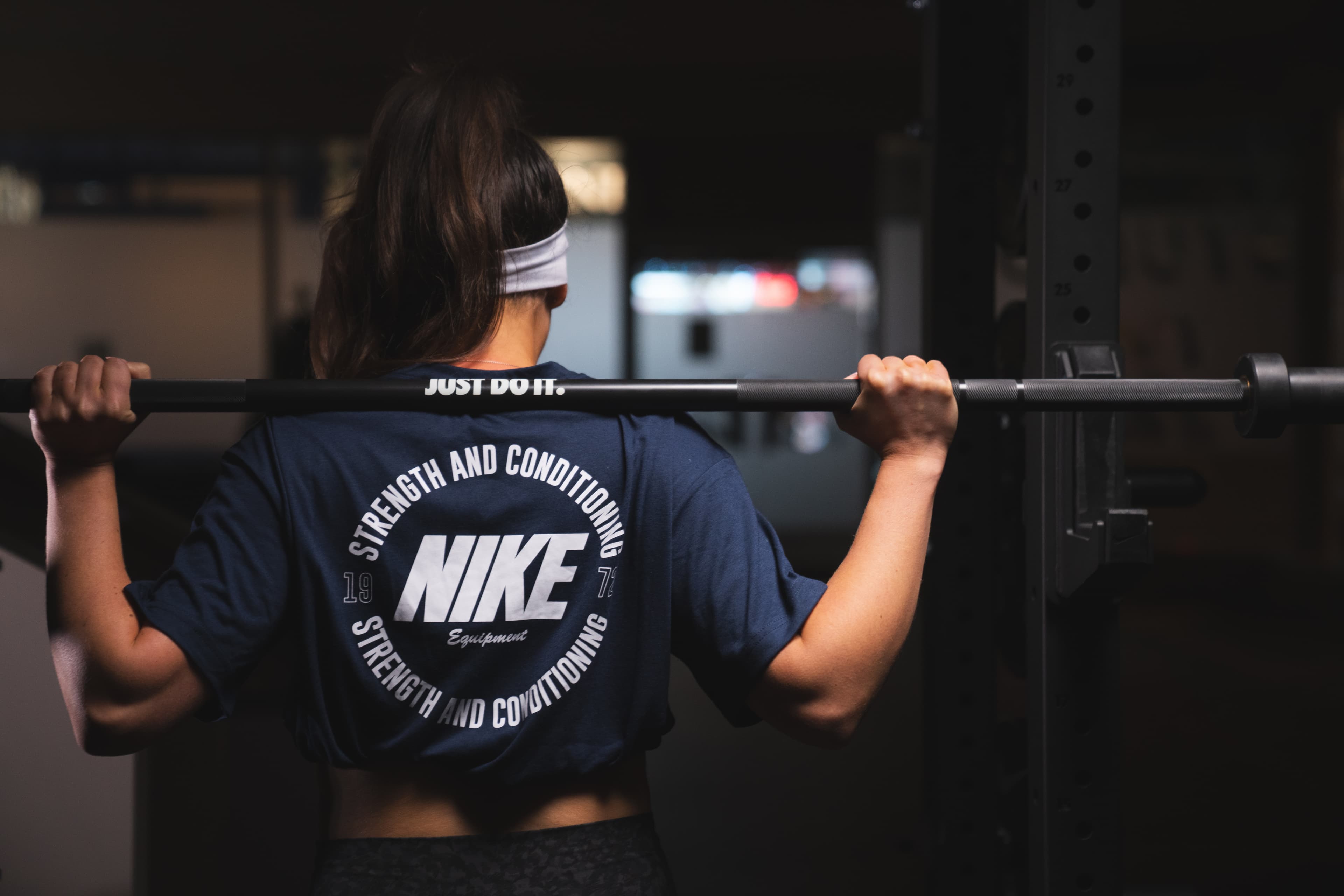 An athlete performing a barbell back squat at Studio 22
